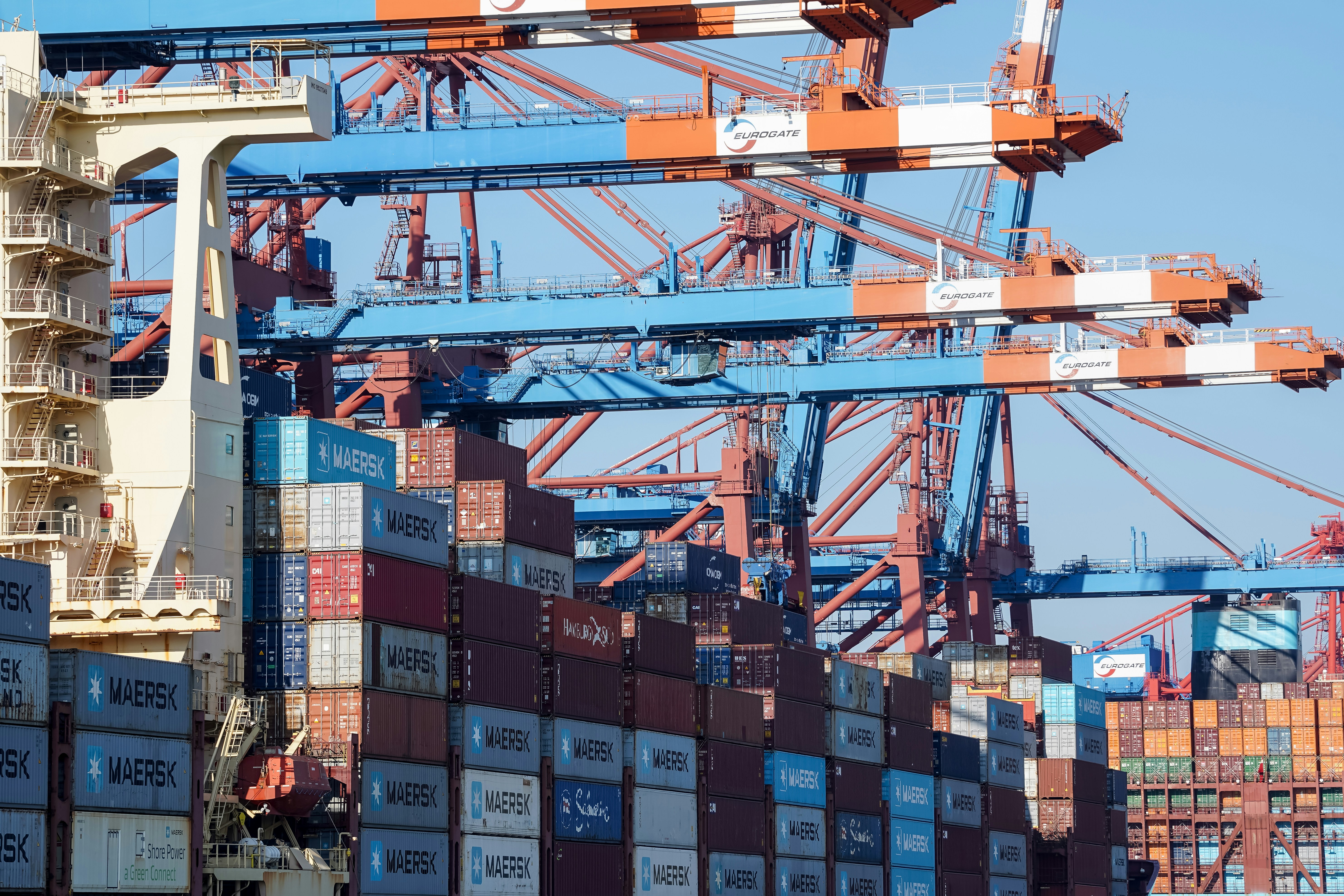Cargo ship and port cranes at a container terminal